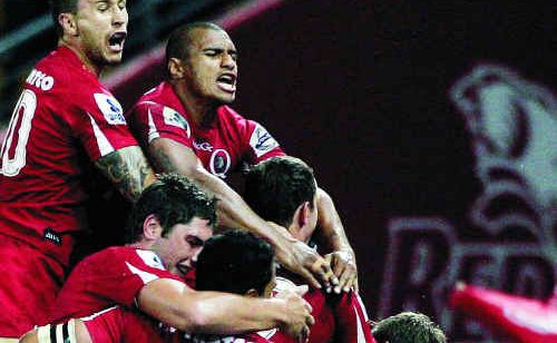 Reds players celebrate victory after the round 10 Super 15 match against the Waratahs at Suncorp Stadium. Reds players celebrate victory after the round 10 Super 15 match against the Waratahs at Suncorp Stadium.